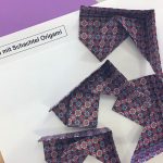 Origami: Die vier Teile für den Deckel sind gefaltet und wollen zusammengesetzt werden